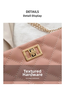 Detailed view of pink quilted handbag featuring elegant gold metal twist lock hardware