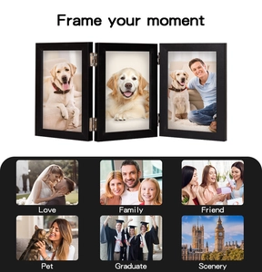 Detailed view of black triple folding wooden photo frame with hinged joints for three photos