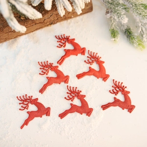 Set of 6 red textured reindeer Christmas tree ornaments on a snowy background