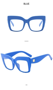 Detailed front and side views of oversized blue eyeglass frames with gold rivet accents