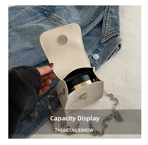 Detail view of mini butterfly chain bag interior capacity for a cushion compact