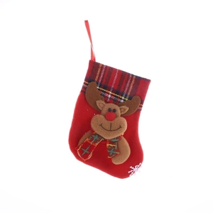 Red Christmas stocking with reindeer plush and classic red-black buffalo plaid trim