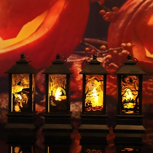Set of four black Halloween LED lanterns featuring witch and castle silhouettes in warm light