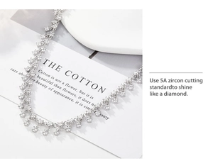 Detailed macro view of 5A grade square-cut zircon stones on a silver tassel necklace