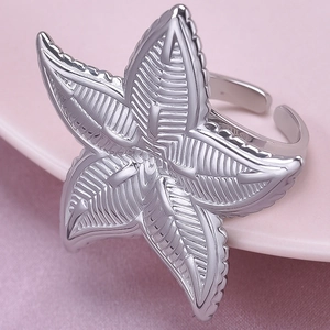 Macro shot of silver 304 stainless steel adjustable ring with maple leaf texture