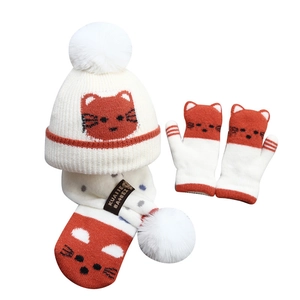 Kids winter set with knit pom-pom hat, scarf, and mittens featuring cute cartoon cat patterns