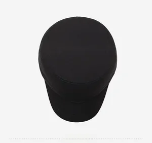 Top view of a black wool flat cap for elderly men with a textured warm fabric finish