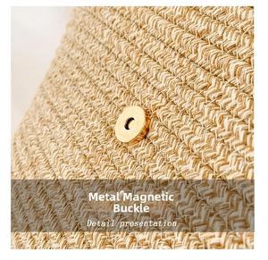 Macro view of gold magnetic hardware clasp and twill weaving on beige woven tote bag