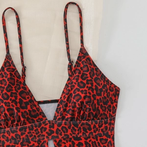 Close-up of sexy leopard print swimsuit with thin straps and deep V-neckline texture
