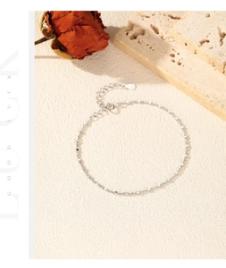 Macro view of S925 sterling silver shimmering chain bracelet with lobster clasp