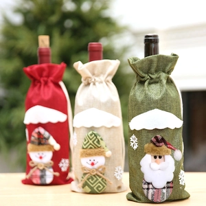 Three Christmas burlap wine bottle bags with 3D snowman and Santa Claus patterns