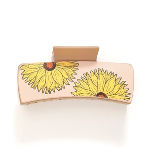 Matte beige shark hair claw clip featuring a vibrant sunflower pattern design