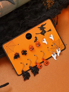 Detail showing various Halloween earring sets with pumpkin, ghost, and spider motifs