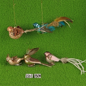 Detailed view of 15cm bird Christmas ornaments with feathers, glitter and metal clips
