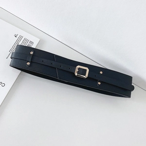 Detail view of black PU leather wide waist belt featuring a square metal buckle and rivets