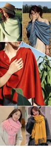 Collage of soft cashmere-feel scarves in various colors with classic fringe details