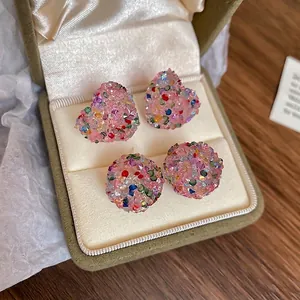 Sparkling heart and round colorful crystal stud earrings in a vintage jewelry box