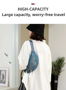 Detail of high-capacity navy nylon crossbody waist bag with gold zippers and metal logo