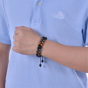 Detail of tiger eye and onyx double-layer beaded bracelet with adjustable cord