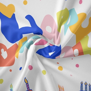 Close-up of bohemian birthday tapestry showing fine twill fabric and vibrant happy birthday print