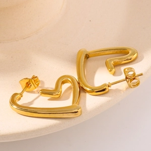 Minimalist 18K gold plated stainless steel abstract heart earrings on ceramic plate