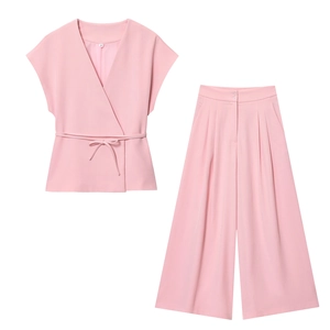 Women's pink two-piece set featuring V-neck wrap tie top and pleated wide-leg trousers