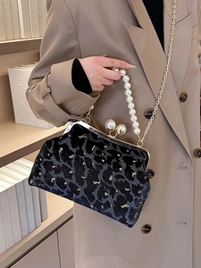 Vintage velvet shell handbag with leopard print, pearl handle, and gold chain strap
