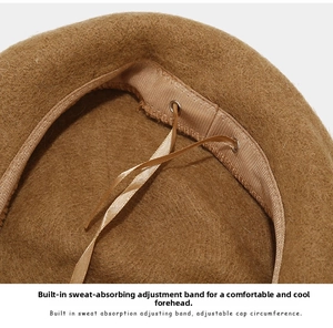 Detailed close-up of wool beret inner lining with adjustable sweatband and drawstring