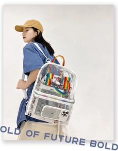 Detail of transparent PVC backpack featuring colorful rainbow straps and white zipper closure