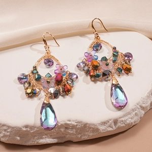 Vintage gold earrings with colorful floral resin and teardrop crystal pendants