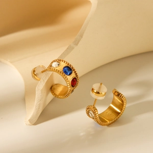 18K gold plated C-shape stainless steel earrings with colorful zircon stones on ivory props