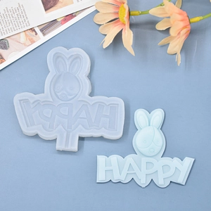 Detail von blauer Hasenform und HAPPY Buchstaben aus Silikon zum Backen und Basteln