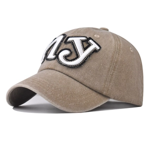 Detail of NY 3D embroidery on vintage washed khaki cotton baseball cap