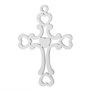 Close-up of silver cross pendant featuring hollow heart patterns and polished metallic finish