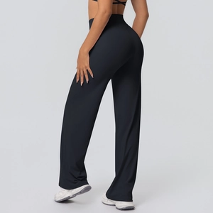 Rear view of high-waisted black yoga flare pants with slimming butt-lifting design