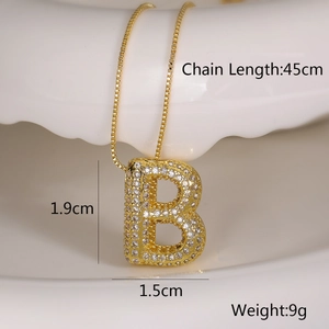 Macro shot of gold letter B pendant necklace with zircon paving and 45cm chain length