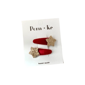 Red flocked star hair clips set for children with gold glitter finish on display card