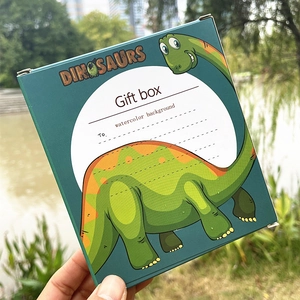 Detail of green dinosaur cartoon gift box with To writing space and English logo