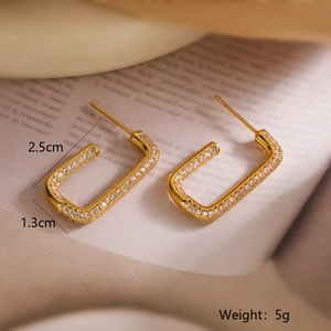 Macro shot of 18K gold-plated rectangular earrings with pavé-set cubic zirconia stones