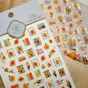 Pro TENSOR nail stickers with sunflower, gold embossed stamp, and art deco stripe patterns