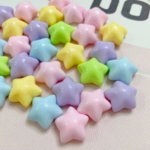 Close-up of assorted macaron colored resin star charms for DIY phone cases and jewelry