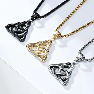 Detailed view of Viking Trinity Knot snake pendants in black, gold, and silver steel