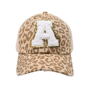 Close-up of leopard print ponytail baseball cap with distressed mesh and letter A patch