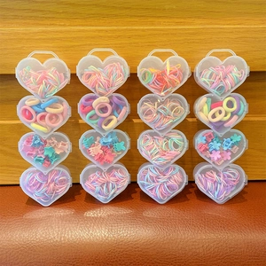 Kids hair accessory set with 16 heart-shaped boxes including macaron elastic bands and clips