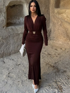 Detail of dark chocolate V-neck dress with ruched waist and metal buckle accent