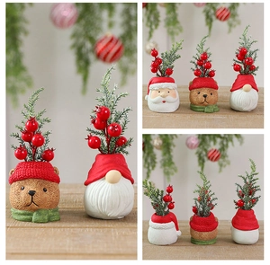 Detailed close-up of resin Christmas miniatures with Santa, bear and gnome figurines