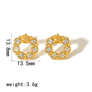 Detail view of 18K gold star earrings with cubic zirconia and size dimensions