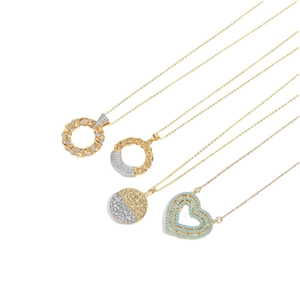 Multi-layer gold necklace set featuring blue heart pendant and cubic zirconia accents