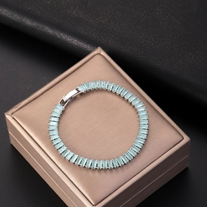 Silver tennis bracelet with 2.5x5mm light blue rectangular cubic zirconia stones