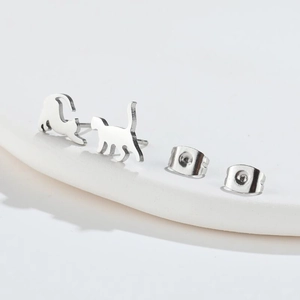 Minimalist silver cat earrings with cute asymmetrical stretching feline silhouette